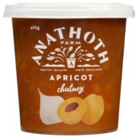 Tub of Anathoth Farm apricot chutney with a white lid and label featuring the brand name.
