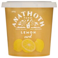 Container of Anathoth Farm lemon curd with a yellow design and lemon illustrations.