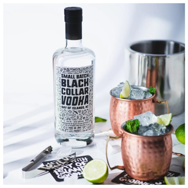 Bottle of Black Collar Vodka with a label featuring intricate designs and text on a light background.