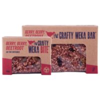 Two packages of Crafty Weka Berry Berry Beetroot snack bars in a neutral setting.