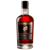 Bottle of Divergence Sloe Gin Barrel Finished Single Malt Whisky with a black label and clear glass.