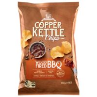 Packet of Copper Kettle Wood Fired BBQ potato chips weighing 150 grams with a bowl of sauce.