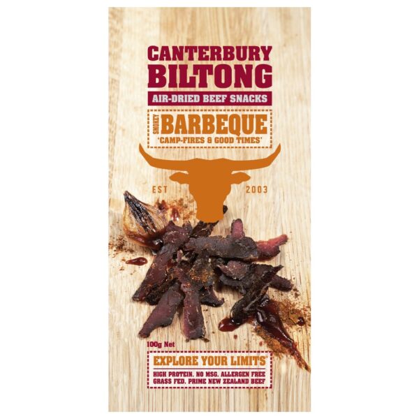 A 100g bag of Canterbury Biltong BBQ beef snacks featuring a bull logo and air-dried beef pieces.
