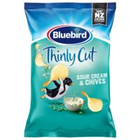 Bluebird Thinly Cut Sour Cream and Chives crisps packet featuring a penguin and a bowl of dip.
