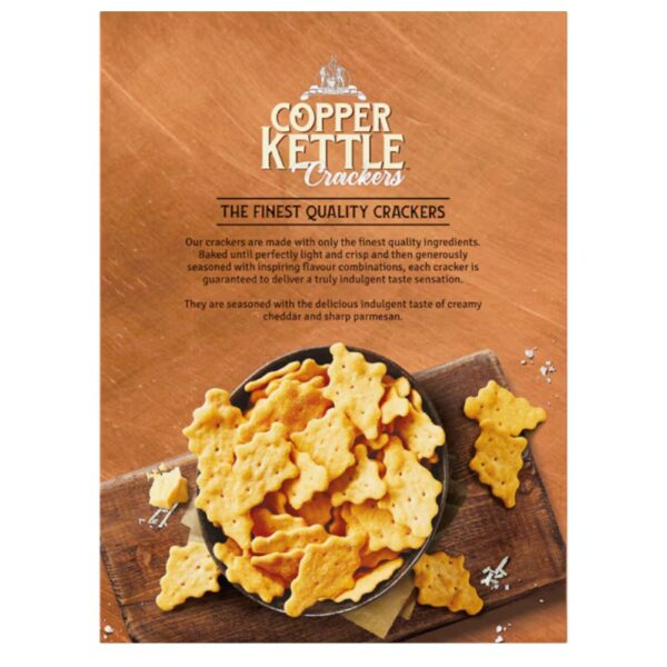 Pack of Copper Kettle Crackers featuring cheddar and parmesan flavours in a bowl on a wooden surface.