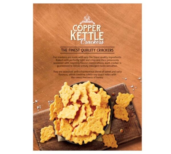 Packaging of Copper Kettle Crackers featuring honey soy flavour with crackers displayed in a bowl.
