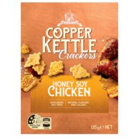 Pack of Copper Kettle Honey Soy Chicken Crackers weighing 135g with a textured orange background.